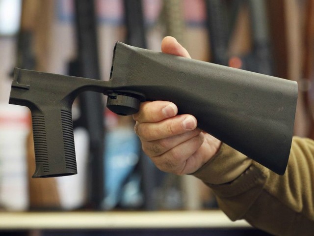 A bump stock device that fits on a semi-automatic rifle to increase the firing speed, making it similar to a fully automatic rifle, is shown here at a gun store on October 5, 2017 in Salt Lake City, Utah. Congress is talking about banning this device after it was reported to of been used in the Las Vegas shootings on October 1, 2017. (Photo by George Frey/Getty Images)