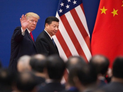 US President Donald Trump (L) and China's President Xi Jinping leave a business leaders event at the Great Hall of the People in Beijing on November 9, 2017. Donald Trump urged Chinese leader Xi Jinping to work "hard" and act fast to help resolve the North Korean nuclear crisis, during …