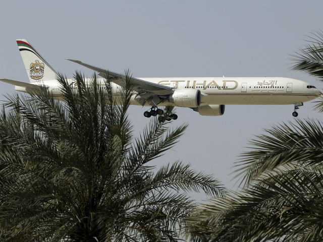 n this Sunday, May 4, 2014 photo, an Etihad Airways plane prepares to land in Abu Dhabi Ai