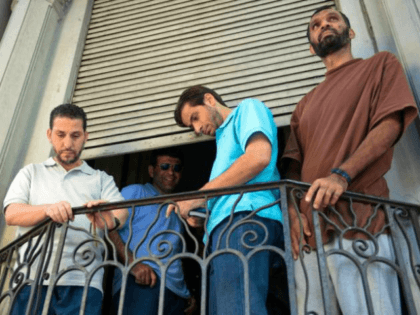 FILE - In this Dec. 12, 2014 file photo, former Guantanamo prisoners, from left, Adel bin