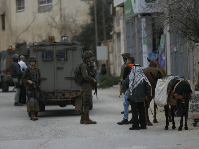 Israeli soldiers search for Palestinian attacker in the village of Kifl Haris near Ariel s