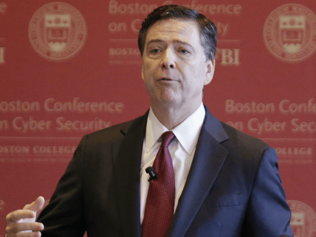 BI Director James B. Comey gestures as he delivers an address on cyber security at the first Boston Conference of Cyber Security at Boston College Wednesday, March 8, 2017, in Boston. (AP Photo/Stephan Savoia)