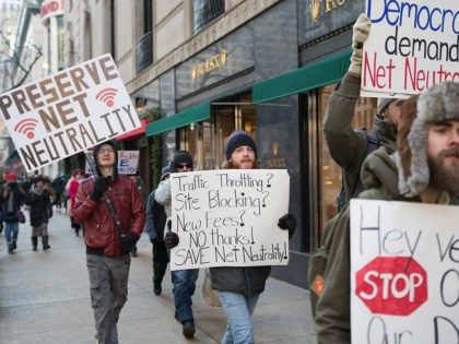 Demonstrators protest a plan by the Federal Communications Commission (FCC) to repeal net