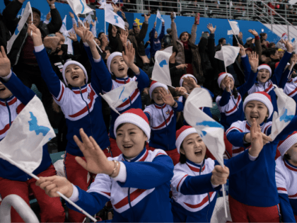 North Korean cheerleaders hold the flags of the unified Korean team during the women's pre
