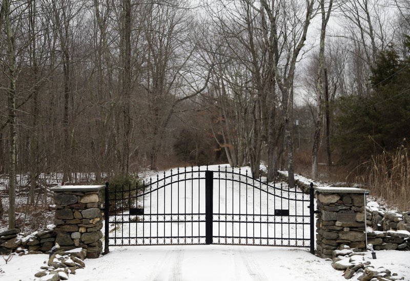 In this Feb. 1, 2018, photo, the gates of Leather Hill Preserve are viewed in Wingdale, N.Y. A company tied to Donald Trump Jr. and Eric Trump owns the 171-acre hunting preserve that is being used as a private shooting range, where the sound of rifle fire from a wooden tower and exploding targets has riled nearby residents, neighbors told The Associated Press. (AP Photo/Seth Wenig)