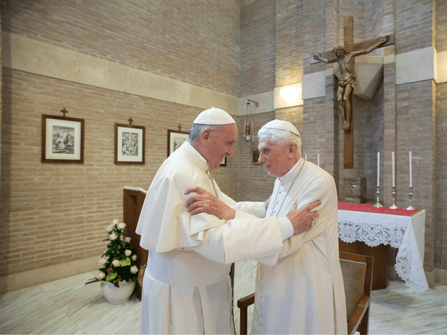 In this photo taken on June 28, 2017, Pope Francis embraces Emeritus Pope Benedict XVI, at the Vatican. The Vatican is denying a German tabloid report that suggested that Emeritus Pope Benedict XVI is suffering from a neurological disease. (L'Osservatore Romano/Pool Photo via AP)