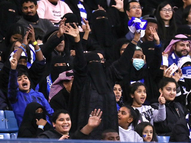 Female supporters of Saudi's Al-Hilal attend their team's football match against Al-Ittihad in the Saudi Pro League at the King Fahd International Stadium in Riyadh on January 13, 2018. Saudi Arabia allowed women to enter a football stadium for the first time to watch a match on January 12, as …