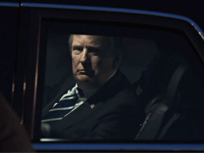 US President Donald Trump looks on from the presidential limo, nicknamed The Beast, following his arrival at Hanoi's Noi Bai airport on November 11, 2017. Trump arrived in the Vietnamese capital after attending the Asia-Pacific Economic Cooperation (APEC) Summit leaders meetings earlier in the day in Danang. / AFP PHOTO …