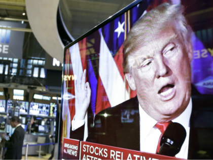 In this Nov. 9, 2016, file photo an image of President-elect Donald Trump appears on a television screen on the floor of the New York Stock Exchange. President Trump has maintained an uncharacteristic silence since the stock market took a nose dive, notable for a businessman president who regularly points …