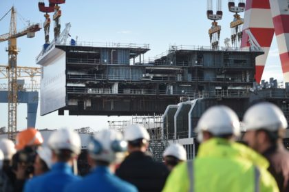 Italian shipmaker Fincantieri buys 50% of French yard STX