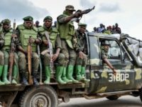 Soldiers of the Armed Forces of the Democratic Republic of Congo sit on a military vehicle in an area of clashes with the ADF militia in Opira, North Kivu, on January 25 US blacklists DRCongo general and three rebel leaders
