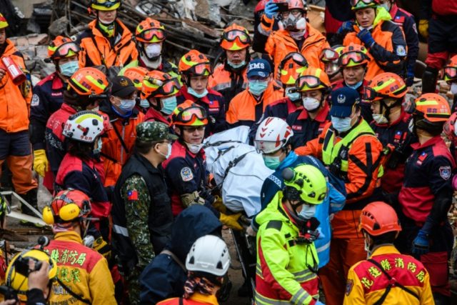 Rescuers brave aftershocks as bodies pulled from teetering Taiwan tower