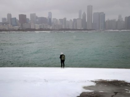 Scores of flights canceled as storm pummels US Midwest