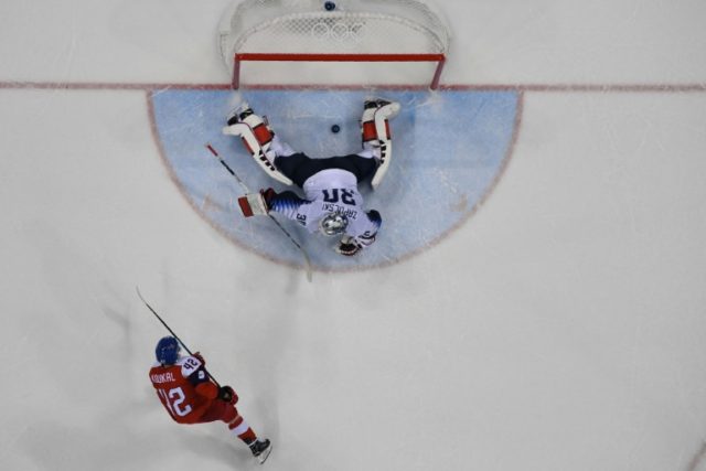 Canada escapes but USA, Sweden knocked out of Olympic men's hockey