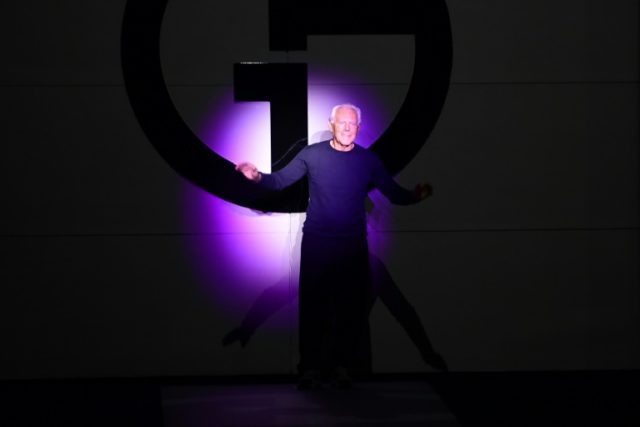 Armani sets his classical style against theatrical excess