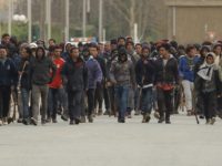 France Migrants Migrants carrying sticks march in the streets of Calais, northern France, Thursday, Feb. 1, 2018. French authorities say four migrants have been shot in the northern port city of Calais in a confrontation that police tried to stop. (AP Photo) The Associated Press