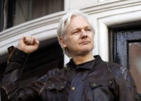 Britain Assange In this May 19, 2017 file photo, WikiLeaks founder Julian Assange greets supporters outside the Ecuadorian embassy in London, where he has been in self imposed exile since 2012. A British judge is scheduled to rule on Tuesday Feb. 6, 2017 on Julian Assange’s bid to force Britain to drop a warrant for his arrest, a development that would remove a substantial legal hurdle to his leaving the Ecuadorean Embassy in London that has been his refuge for more than five years. Here is a look at the legal issues surrounding the complex case of the WikiLeaks founder. (AP Photo/Frank Augstein, FILE) British judge upholds arrest warrant for Julian Assange