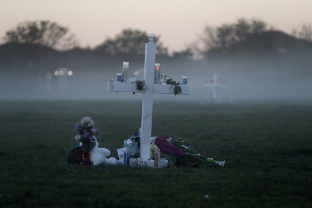 APTOPIX School Shooting Florida An early morning fog rises where 17 memorial crosses were placed, for the 17 deceased students and faculty from the Wednesday shooting at Marjory Stoneman Douglas High School, in Parkland, Fla., Saturday, Feb. 17, 2018. As families began burying their dead, authorities questioned whether they could have prevented the attack at the high school where a gunman, Nikolas Cruz, took several lives. (AP Photo/Gerald Herbert) The Associated Press