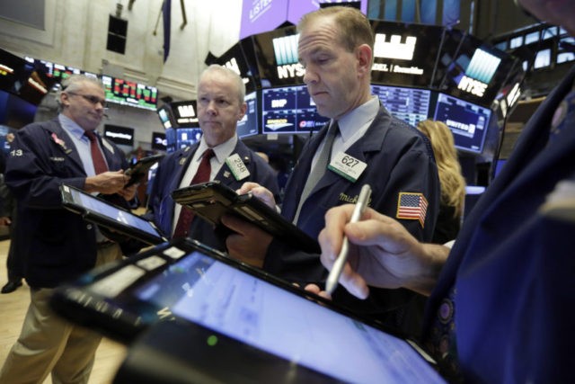 Financial Markets Wall Street Frank O'Connell, James Riley, Michael Smyth Traders Frank O'Connell, James Riley, and Michael Smyth, left to right, work on the floor of the New York Stock Exchange, Friday, Feb. 23, 2018. Stocks are opening higher on Wall Street, led by gains in technology companies and banks. (AP Photo/Richard Drew) The Associated Press