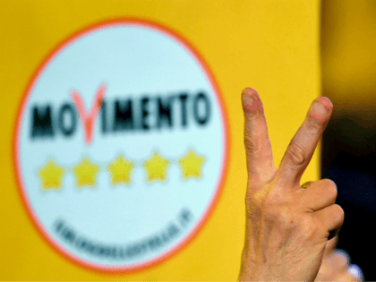 A supporter of the Italy's populist Five Star Movement (M5S) flashes the v for victory sign after the last election campaign meeting in Piazza del Popolo in Rome on March 2, 2018. Italy's anti-establishment Five Star Movement broke with tradition on March 1, 2018, by announcing its list of ministerial …