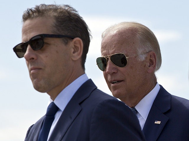 Family members gather for a road naming ceremony with U.S. Vice President Joe Biden, centr