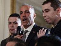 Andrew Pollack, father of slain Marjory Stoneman Douglas High School student Meadow Jade Pollack, joined by his sons, speaks during a listening session with President Donald Trump, high school students, teachers and others in the State Dining Room of the White House in Washington, Wednesday, Feb. 21, 2018. (AP Photo/Carolyn …