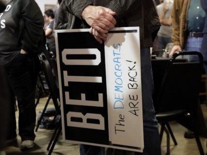 A supporter of senate hopeful Beto O'Rourke holds a sign during a Democratic watch party f