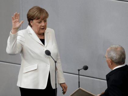 German Chancellor Angela Merkel takes the oath of office in front of Parliament President