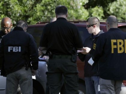 FBI agents work at a scene near the site of Sunday's deadly explosion, Monday, March 19, 2018, in Austin, Texas. Fear escalated across Austin on Monday after the fourth bombing this month — this time, a blast that was triggered by a tripwire and demonstrated what police said was a …