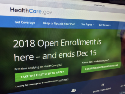 In this Dec. 15, 2017 photo, the HealthCare.gov website is photographed in Washington. A new tally by The Associated Press finds that nearly 11.8 million Americans have signed up for coverage this year under former President Barack Obama’s health care law. That’s only about 3 percent less than last year, …