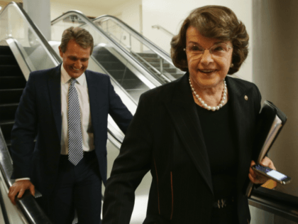 U.S. Sen. Dianne Feinstein (D-CA) and Sen. Jeff Flake (R-AZ) leave after a vote on Loretta Lynch to become the next U.S. Attorney General April 23, 2015 on Capitol Hill in Washington, DC. The Senate has confirmed the nomination with a vote of 56 to 43. (Photo by Alex Wong/Getty …