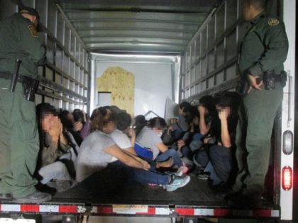 Migrants found being smuggled in truck.