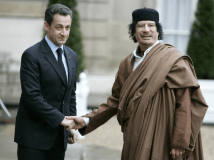FILE - In this Dec. 10 2007 file photo, French President Nicolas Sarkozy, left, greets Libyan leader Col. Moammar Gadhafi upon his arrival at the Elysee Palace, in Paris. Former French President Nicolas Sarkozy was placed in custody on Tuesday March 20, 2018as part of an investigation that he received …