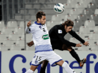 CA Bastia's Anthony Salis (R) vies with Bastia's French defender Gaetan Varenne (L) during the French Cup football match CA Bastia (CAB) vs Sporting Club de Bastia (SCB) at the Francois Coty stadium in Ajaccio, Corsica, on January 6, 2013. AFP PHOTO / PASCAL POCHARD-CASABIANCA (Photo credit should read PASCAL POCHARD-CASABIANCA/AFP/Getty Images)