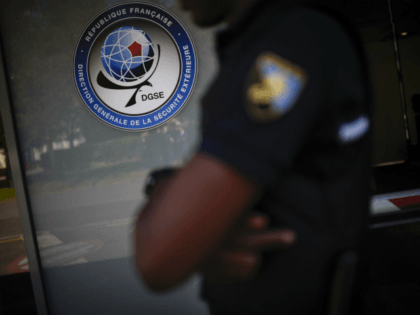 A security guard stands at the headquarters of the General Directorate for External Securi