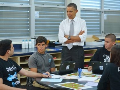 US President Barack Obama chats with students while visiting a classroom at Coral Reef Hig