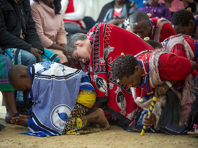 Twelve-year-old South African Kyle Todd (C) performs during his initiation ceremony to become a Sangoma or traditional healer at a traditional healer school on November 14, 2015, in Pretoria, South Africa. South African traditional healers are practitioners of traditional African medicine in Southern Africa. They fulfill different social and political …