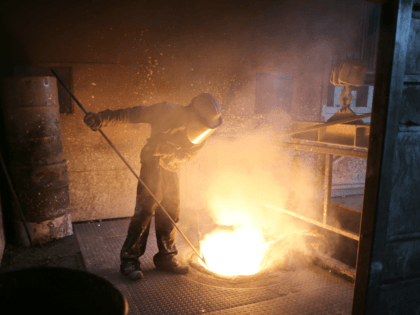 ROTHERHAM, ENGLAND - APRIL 18: A worker tends to the furnace producing ferrotitanium durin