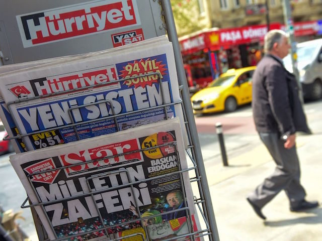 This picture taken in Istanbul on April 17, 2017, shows the front pages of Turkish newspapers bearing headlines a day after Turkey's referendum : Hurriyet (top) bearing a headline which translates as "New System" and Star bearing a headline which translates as " Victory of people". The deputy leader of …