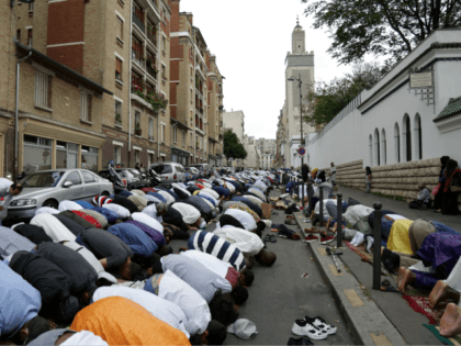 Muslims offer Eid al-Fitr prayers outside the Grande Mosquee de Paris (Great Mosque of Paris) in Paris on June 25, 2017. Eid al-Fitr festival marks the end of the holy Muslim fasting month of Ramadan during which devotees are required to abstain from food, drink and sex from dawn to …
