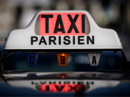 A taxi sign is illuminated in red to signify it is not available for hire during a protest by licensed taxi drivers in Paris on January 17, 2018, to ask the authorities for the compliance and enforcement of legislation concerning VTC drivers (private hire drivers) operating in the French capital. …