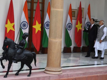 India's Prime Minister Narendra Modi (R) walks with Vietnam's President Tran Dai Quang prior to a meeting and agreement signing in New Delhi on March 3, 2018. / AFP PHOTO / PRAKASH SINGH (Photo credit should read PRAKASH SINGH/AFP/Getty Images)