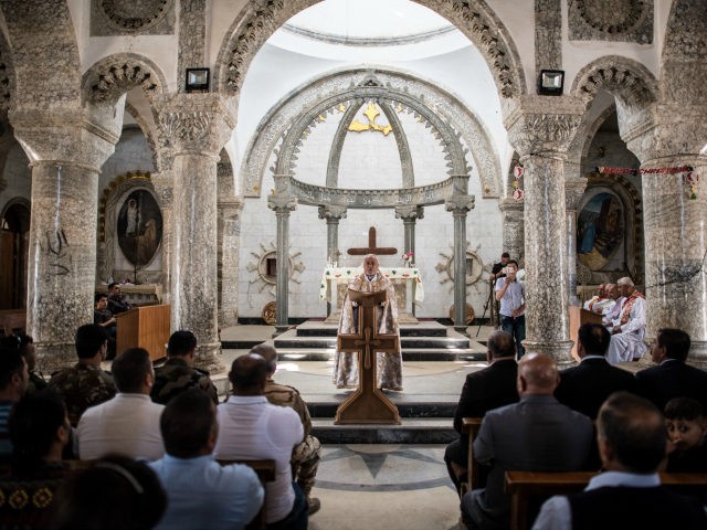 Iraqi Syriac Christian priest Charbel Aesso leads an easter service at Saint John's Church (Mar Yohanna) in the nearly deserted predominantly Christian Iraqi town of Qaraqosh on April 16, 2017 near Mosul, Iraq. Qaraqosh was retaken by Iraqi forces in 2016 during the offensive to capture the nearby city of …