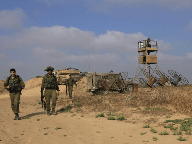 Israeli soldiers patrol near the Israeli Gaza border, Monday June 08, 2009. Israeli troops