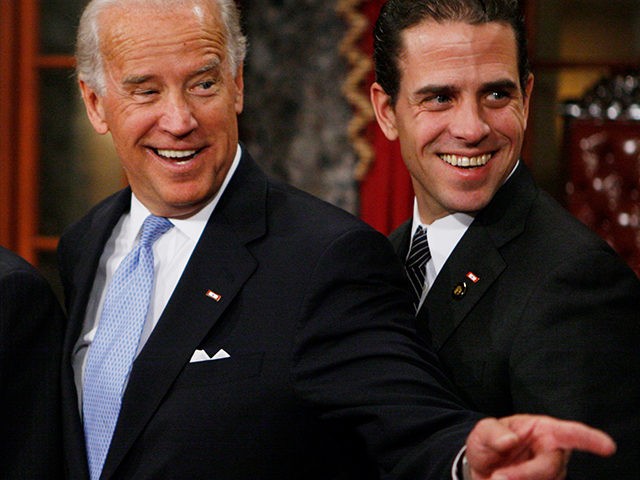 Vice President-elect, Sen. Joe Biden, D-Del., left, stands with his son Hunter during a re-enactment of the Senate oath ceremony, Tuesday, Jan. 6, 2009, in the Old Senate Chamber on Capitol Hill in Washington. (AP Photo/Charles Dharapak)