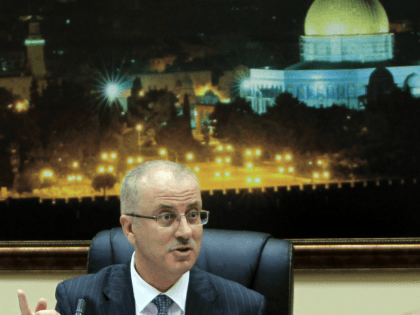 Palestinian Prime Minister, Rami Hamdallah talks during the first cabinet meeting of the new Palestinian unity government in the West Bank city of Ramallah on June 3, 2014. Under terms of the agreement, Hamas and Fatah, which dominates the West Bank administration, worked together to formulate an interim government of …