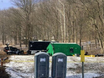 In this March 13, 2018 photo, FBI agents and representatives of the Pennsylvania Department of Conservation and Natural Resources set up a base off Route 555 in Benezette Township, Elk County, Pa., at a site where treasure hunters say Civil War-era gold is buried.