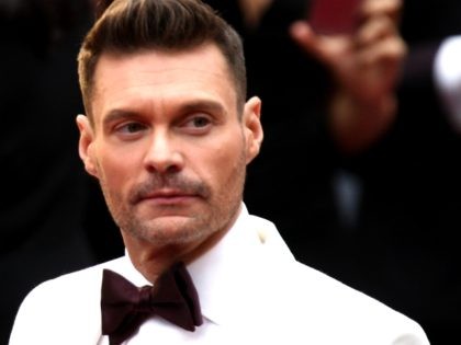US tv producer Ryan Seacrest poses as he arrives on the red carpet for the 89th Oscars on