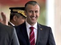 In this Feb. 1, 2017 photo, Venezuela's Vice President Tareck El Aissami, right, is saluted by Boilivarian Army officer upon his arrival for a military parade at Fort Tiuna in Caracas, Venezuela. The administration of President Donald Trump is slapping sanctions on El Aissami and accusing him of playing a major role in international drug trafficking. Thats according to individuals briefed on the U.S. governments plans who requested anonymity to disclose the move ahead of a formal announcement. (AP Photo/Fernando Llano)