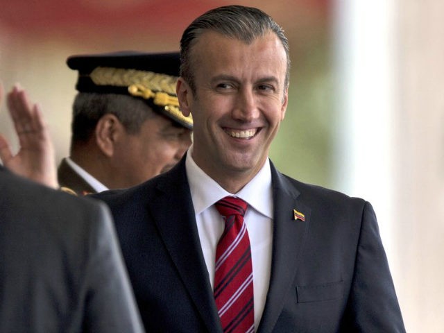 In this Feb. 1, 2017 photo, Venezuela's Vice President Tareck El Aissami, right, is saluted by Boilivarian Army officer upon his arrival for a military parade at Fort Tiuna in Caracas, Venezuela. The administration of President Donald Trump is slapping sanctions on El Aissami and accusing him of playing a …